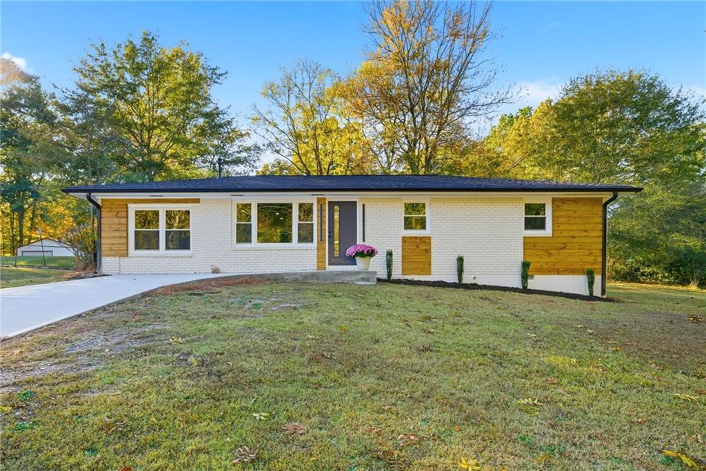 6807 Tralee Drive Lithia Springs, GA 30122 - Photo 2 of 36 a view of a house with a backyard