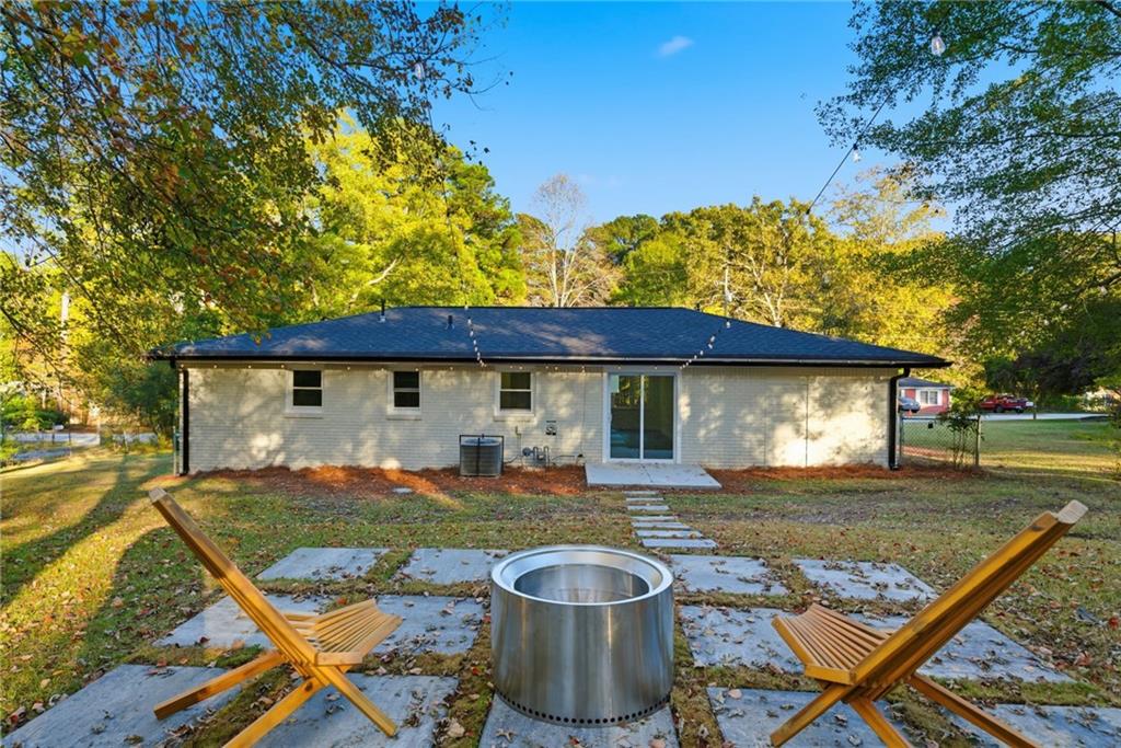6807 Tralee Drive Lithia Springs, GA 30122 - Photo 33 of 36 a view of a house with backyard and sitting area