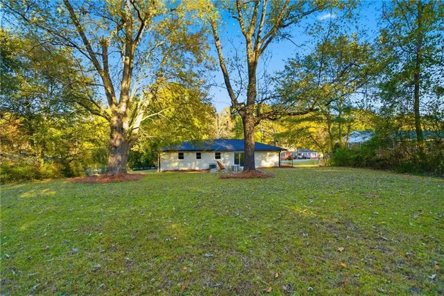a view of a big yard next to a house