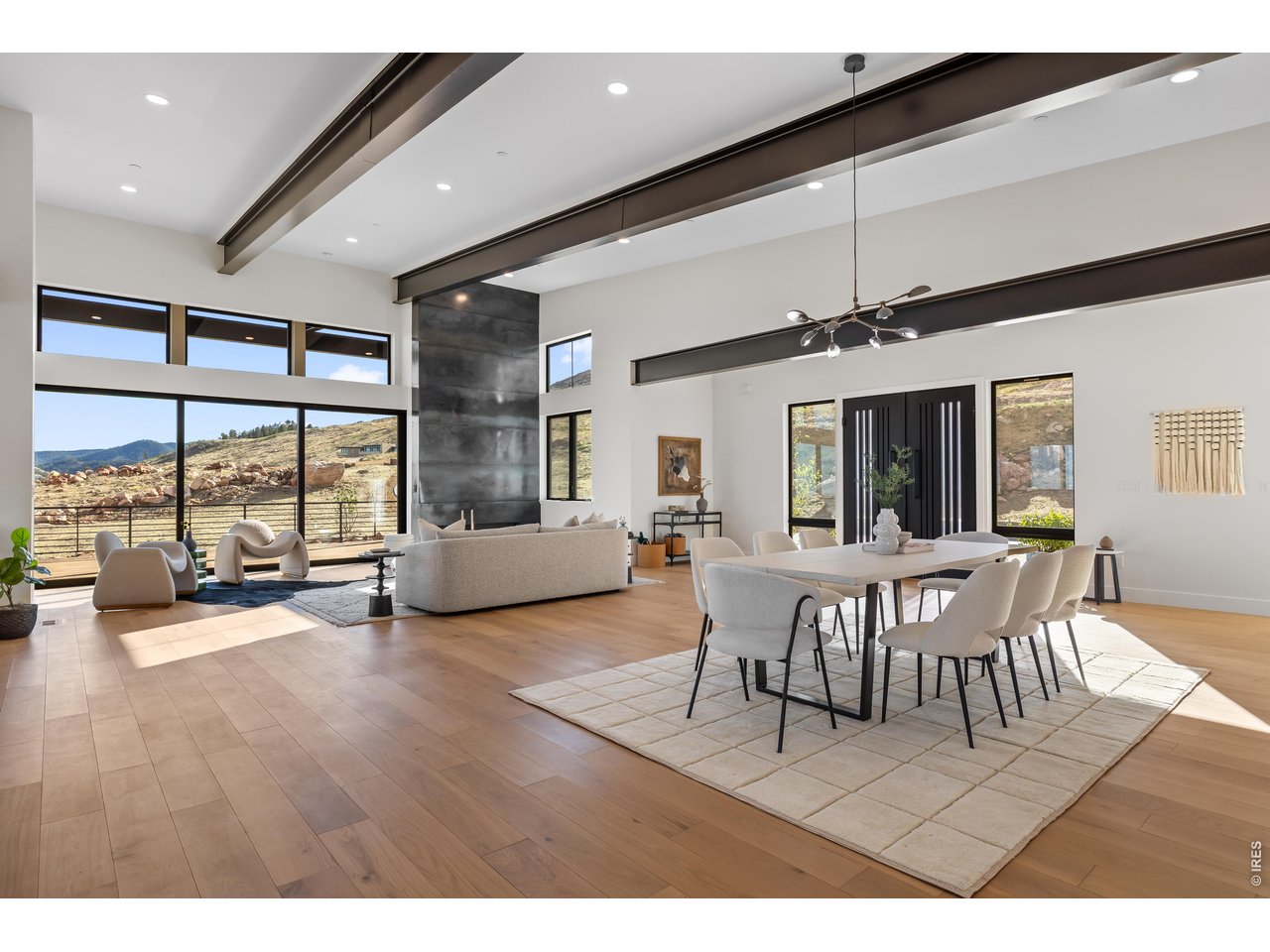 9578 Mountain Ridge Drive Boulder, CO 80302 - Photo 15 of 47 a dining room with furniture a chandelier and window