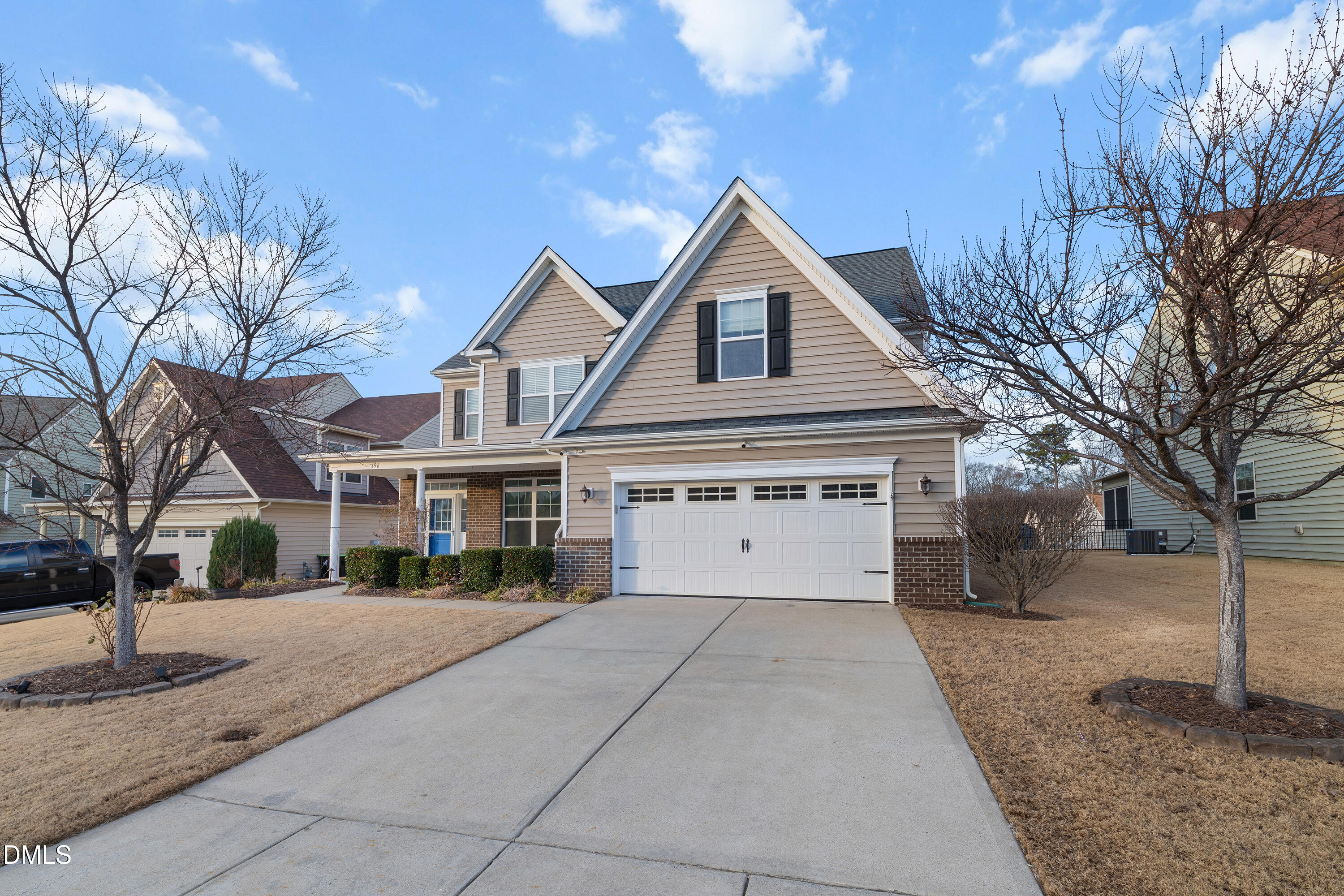 396 Naples Lane Clayton, NC 27527 - Photo 1 of 33 a front view of a house with a yard and trees