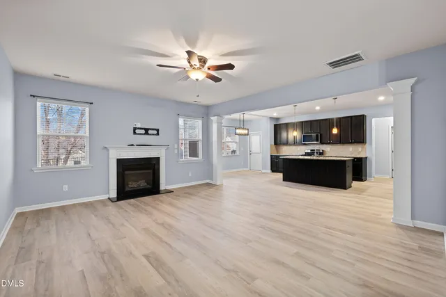 a view of an entryway with wooden floor and stairs