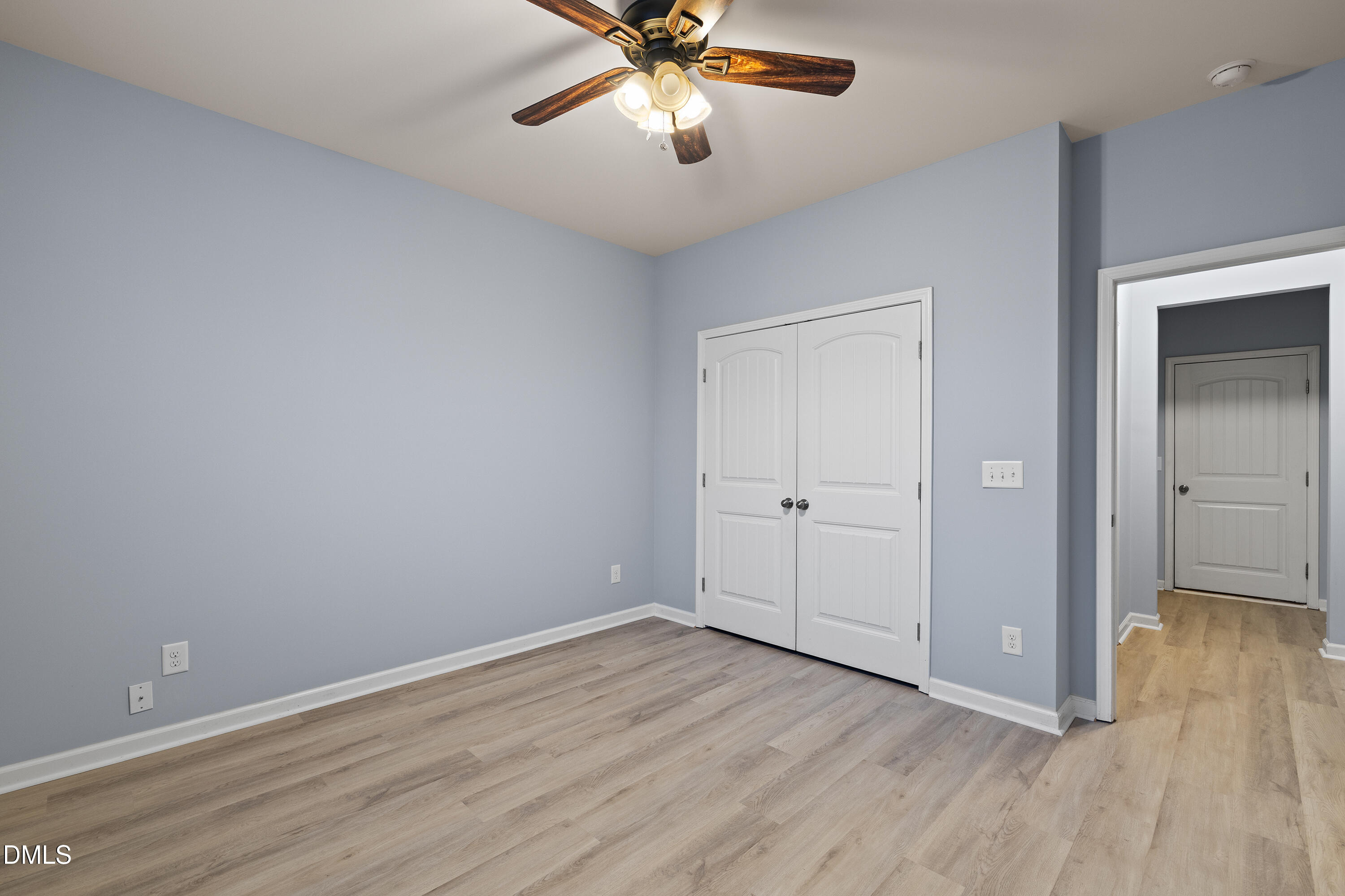 396 Naples Lane Clayton, NC 27527 - Photo 14 of 33 wooden floor in an empty room with a window