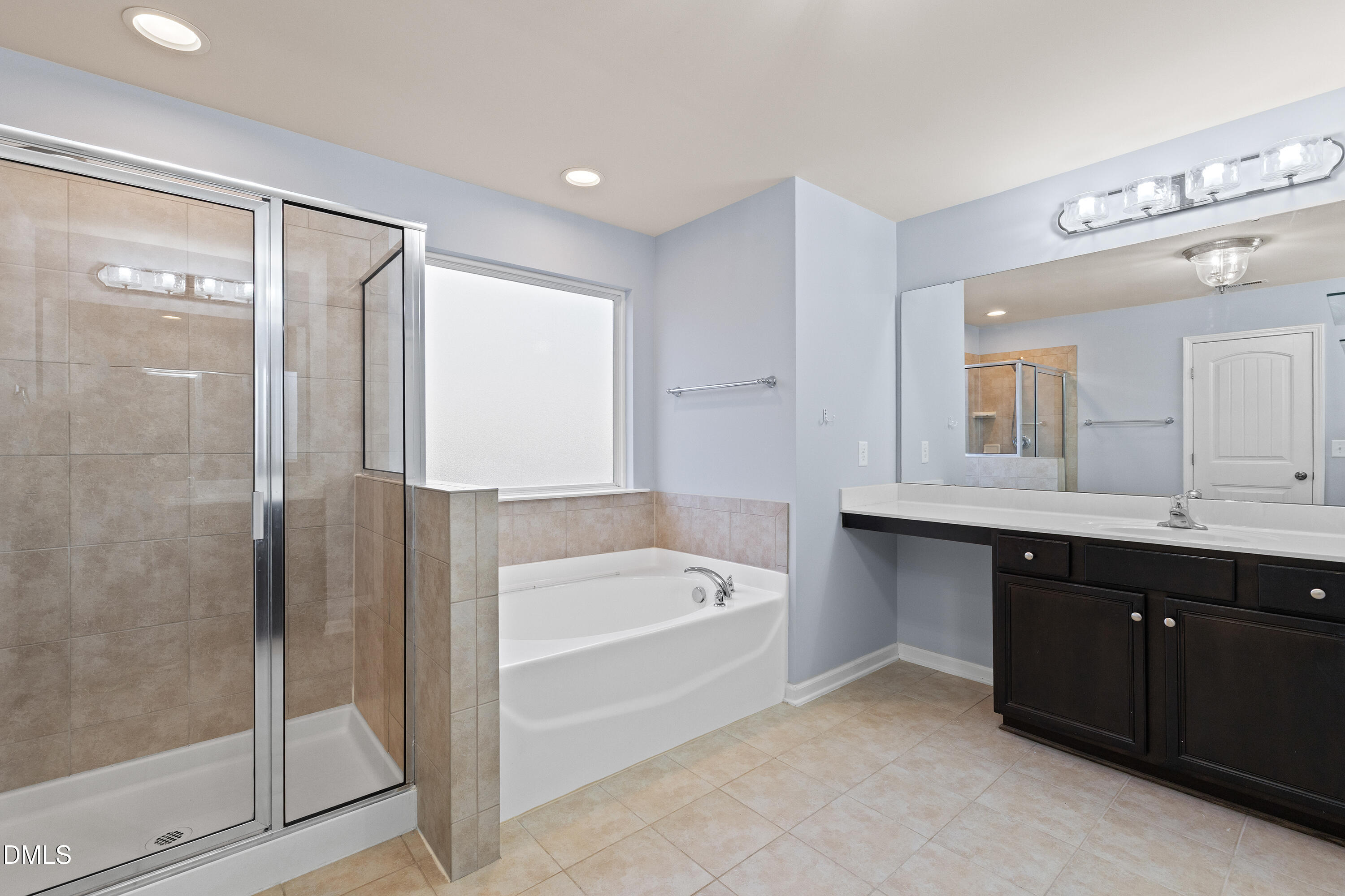 396 Naples Lane Clayton, NC 27527 - Photo 18 of 33 a spacious bathroom with a tub shower and sink