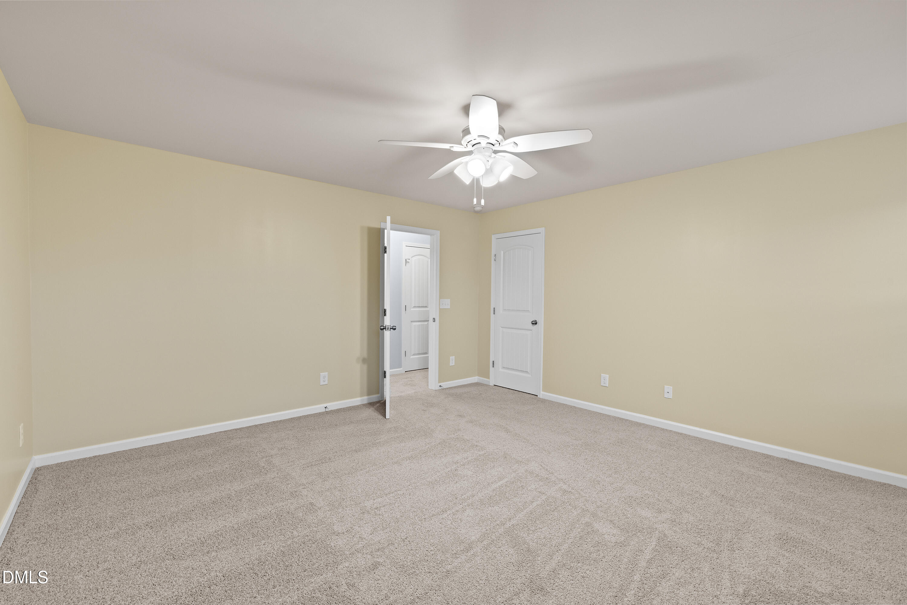396 Naples Lane Clayton, NC 27527 - Photo 21 of 33 an empty room with a window and a fan