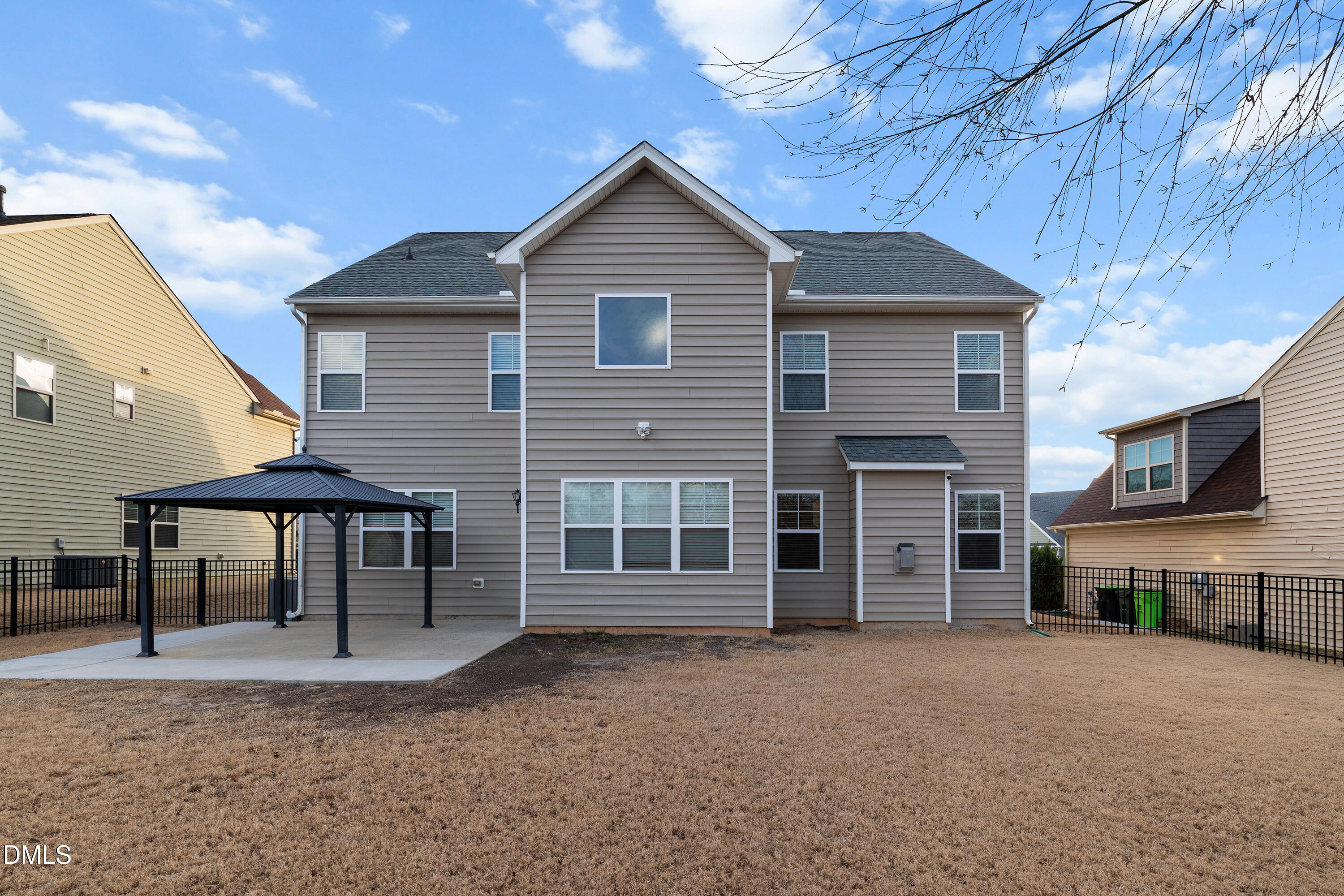 396 Naples Lane Clayton, NC 27527 - Photo 4 of 33 a view of a house with a yard and sitting space