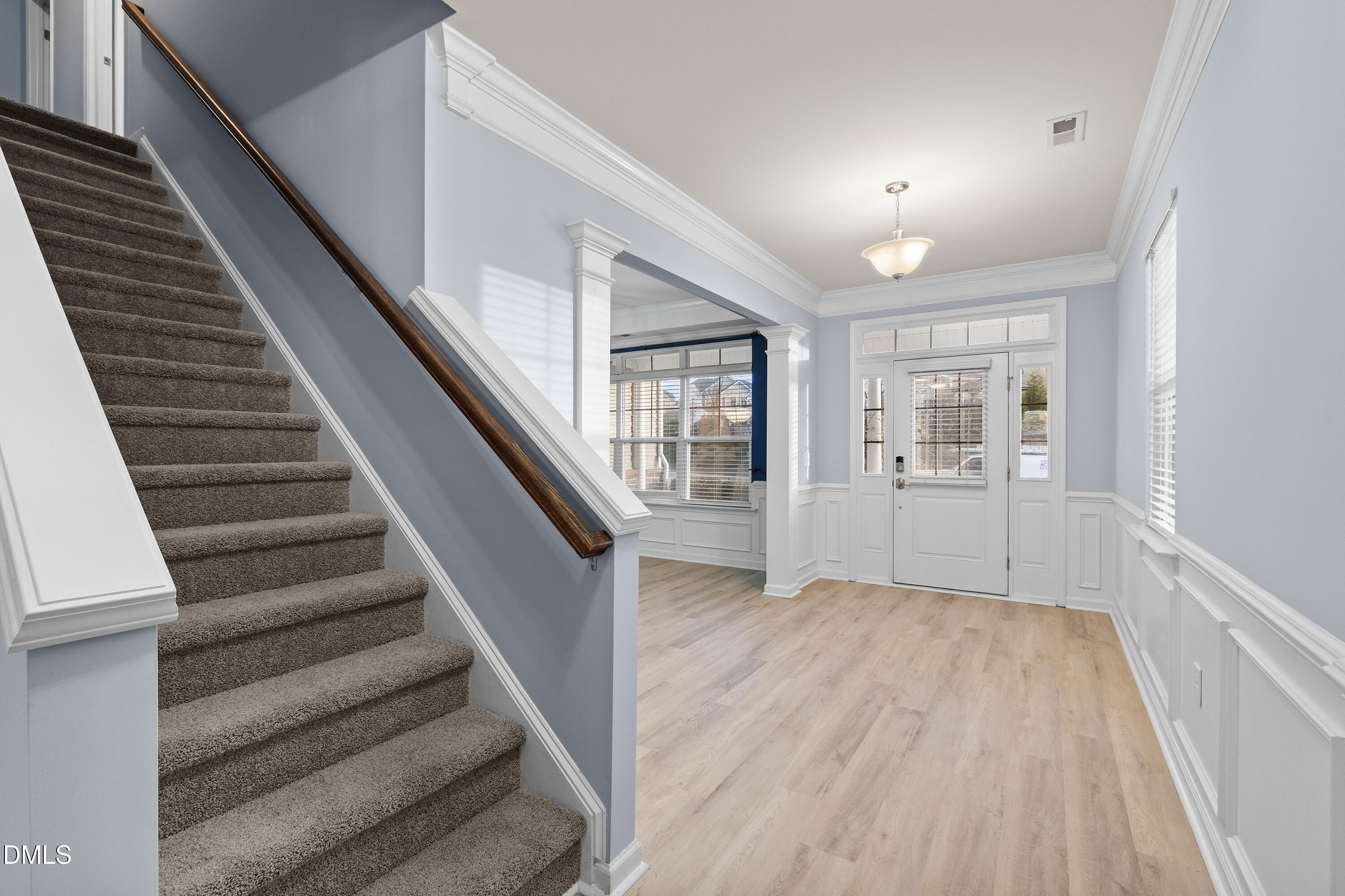 396 Naples Lane Clayton, NC 27527 - Photo 5 of 33 a view of an entryway with wooden floor and stairs