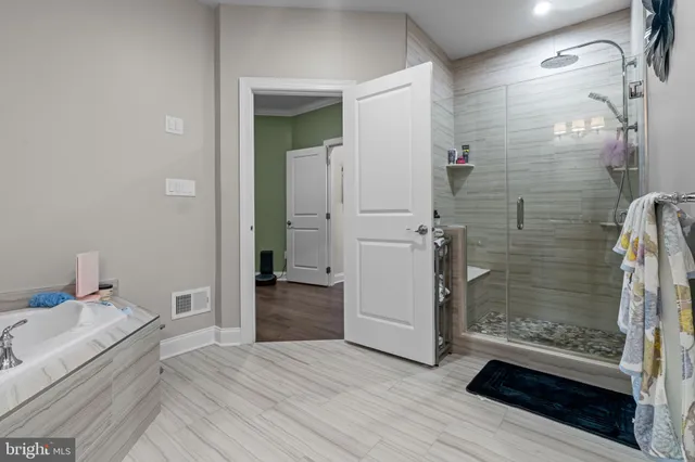 a bathroom with a sink and shower