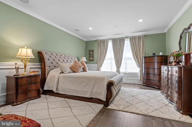 a bedroom with a large bed and a walk in closet