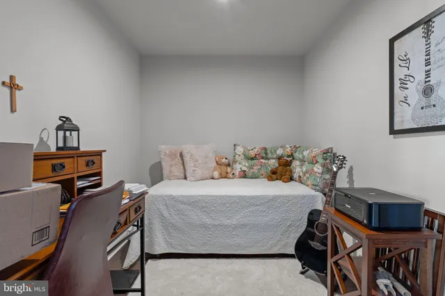 a spacious bedroom with two beds and a large window