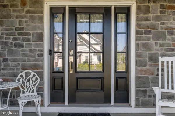 a front view of a house with a glass door