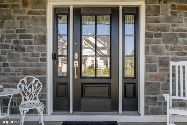 a front view of a house with a glass door