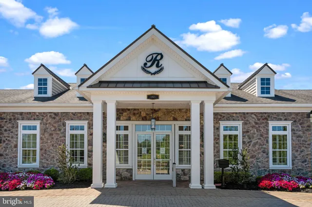 front view of a house with a garden