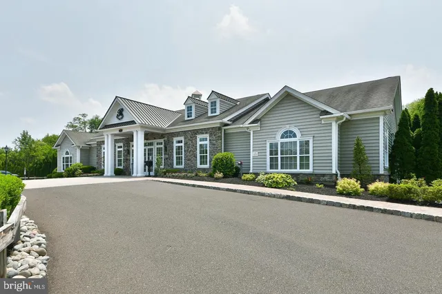 swimming pool view with a seating space