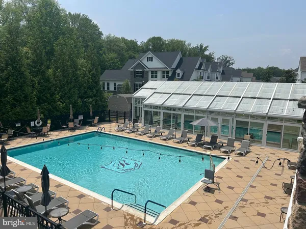 a view of indoor pool and sitting area
