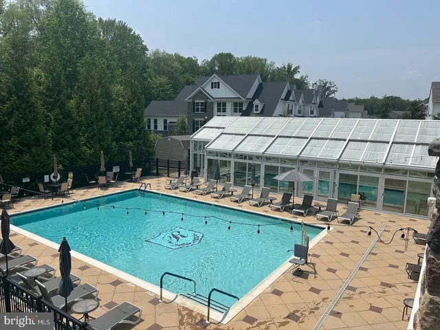 a view of indoor pool and sitting area