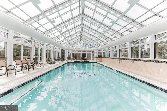 a view of pool with outdoor seating