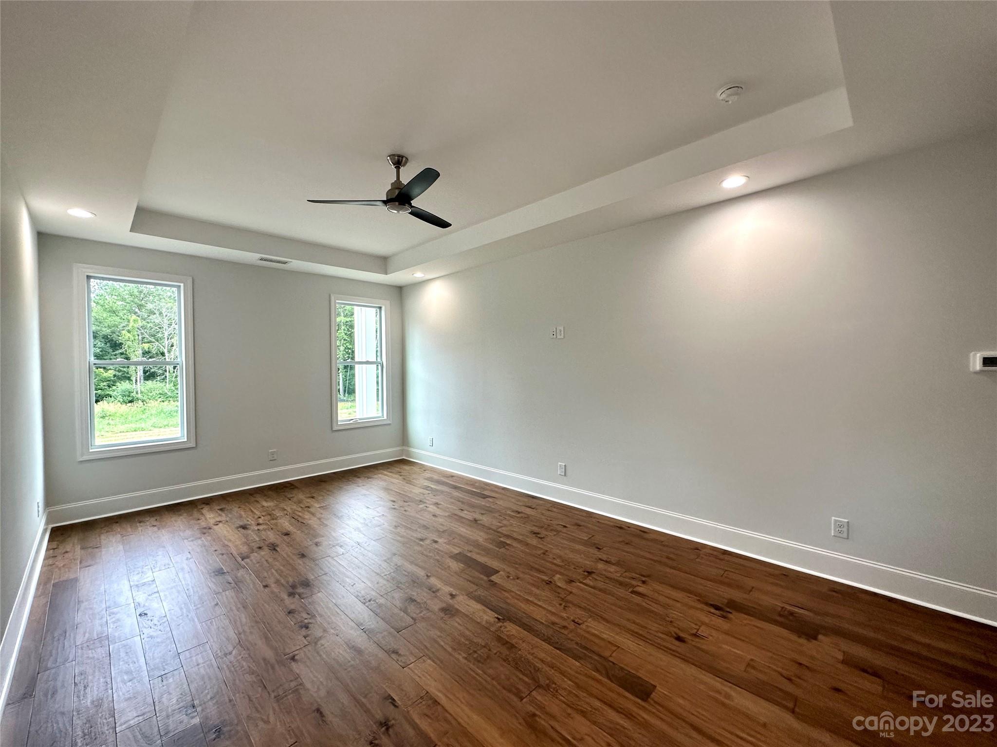 1427 Oak Park Road Rock Hill, SC 29730 - Photo 13 of 29 an empty room with wooden floor and windows
