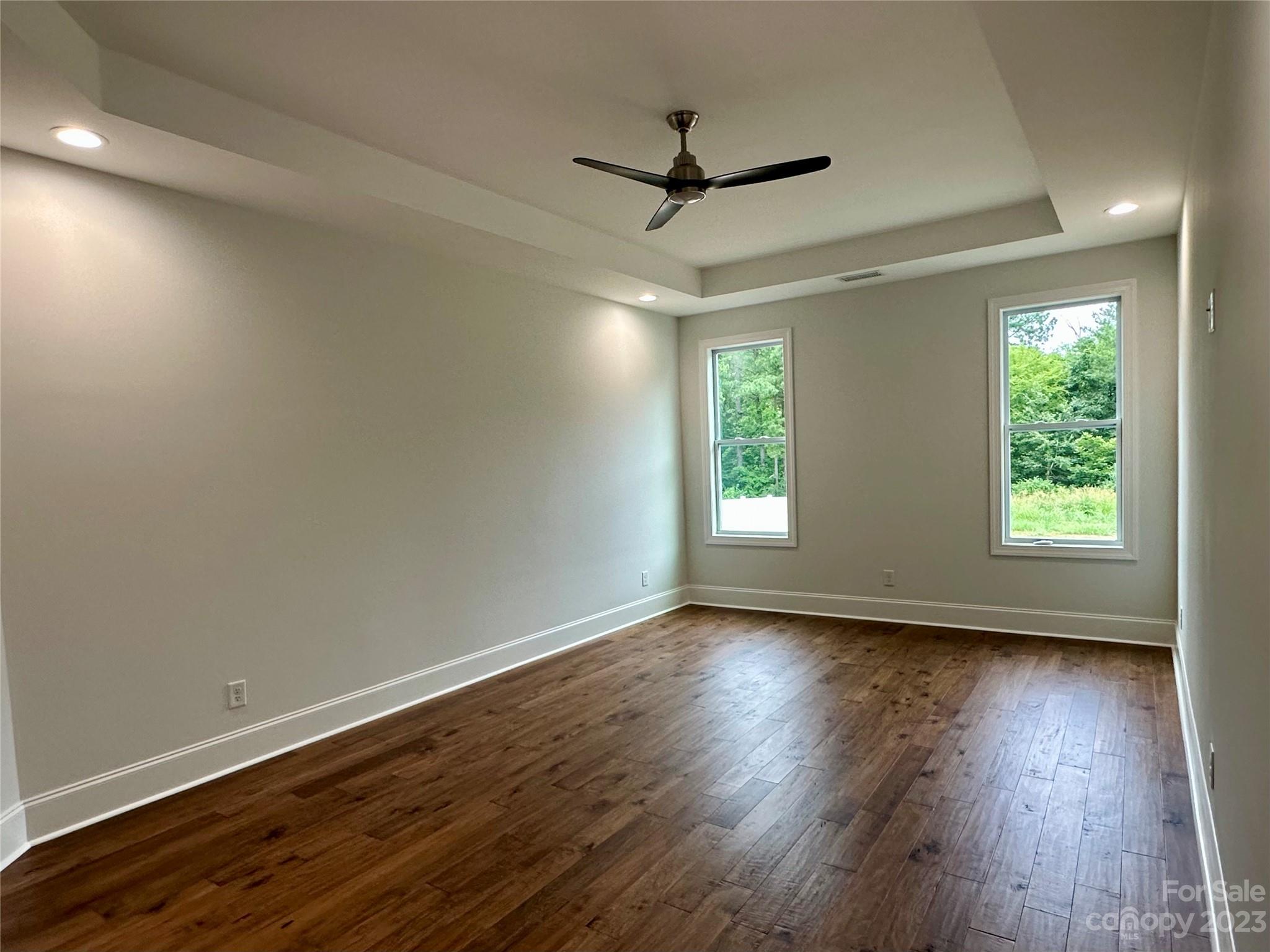 1427 Oak Park Road Rock Hill, SC 29730 - Photo 14 of 29 a view of an empty room with wooden floor and a window