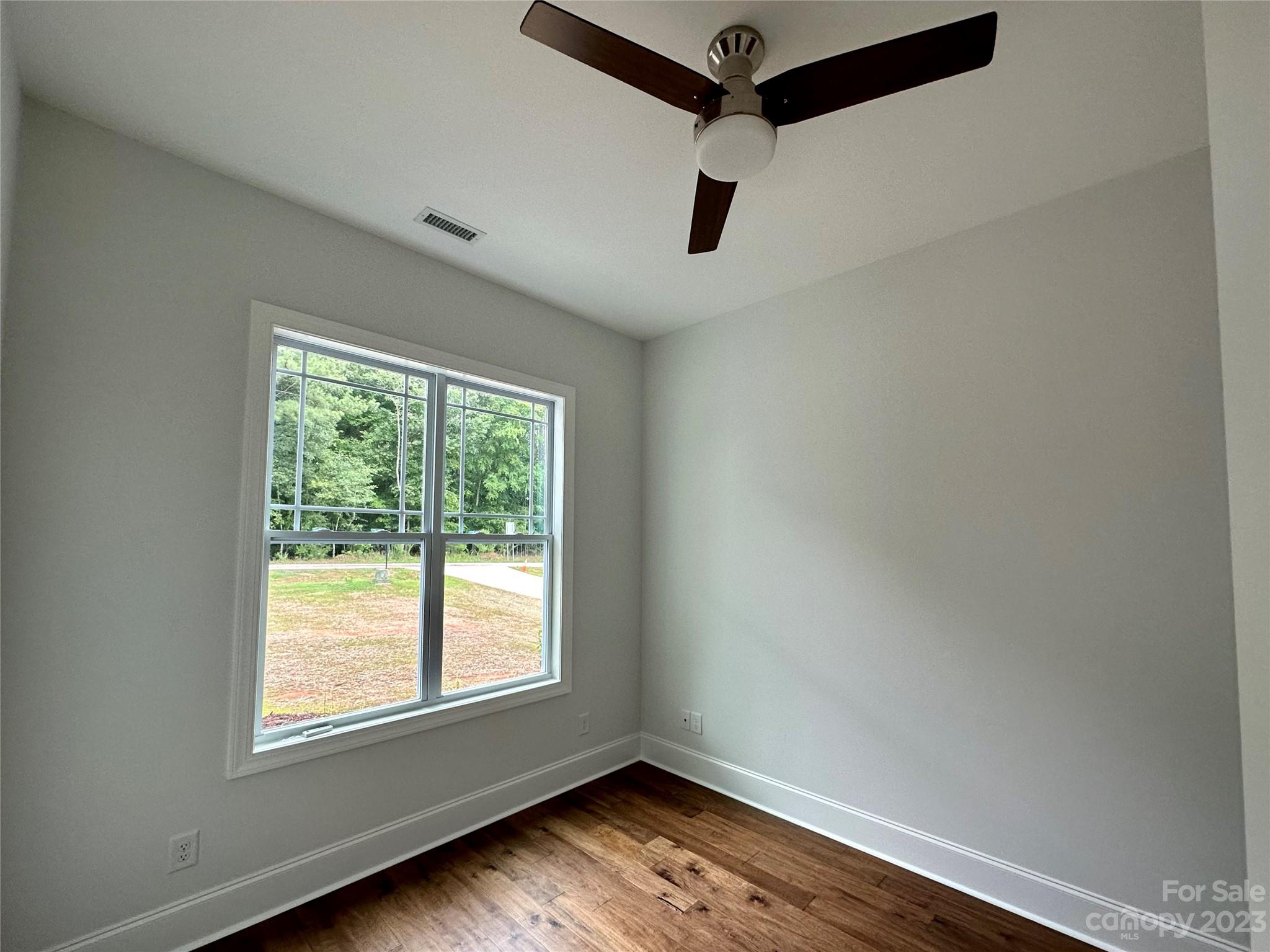 1427 Oak Park Road Rock Hill, SC 29730 - Photo 20 of 29 a view of empty room with wooden floor and fan