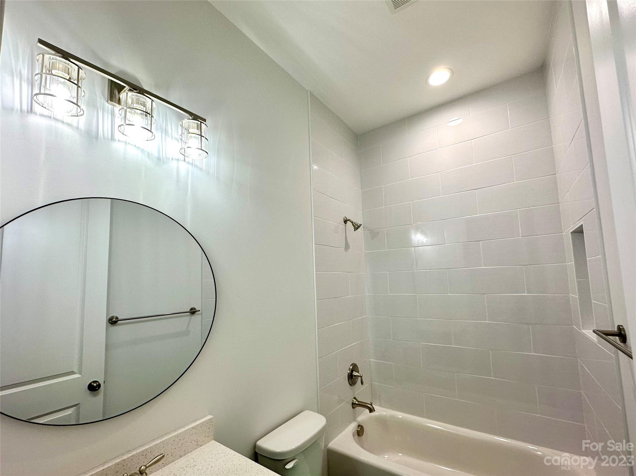 1427 Oak Park Road Rock Hill, SC 29730 - Photo 21 of 29 a bathroom with a toilet a mirror and a shower