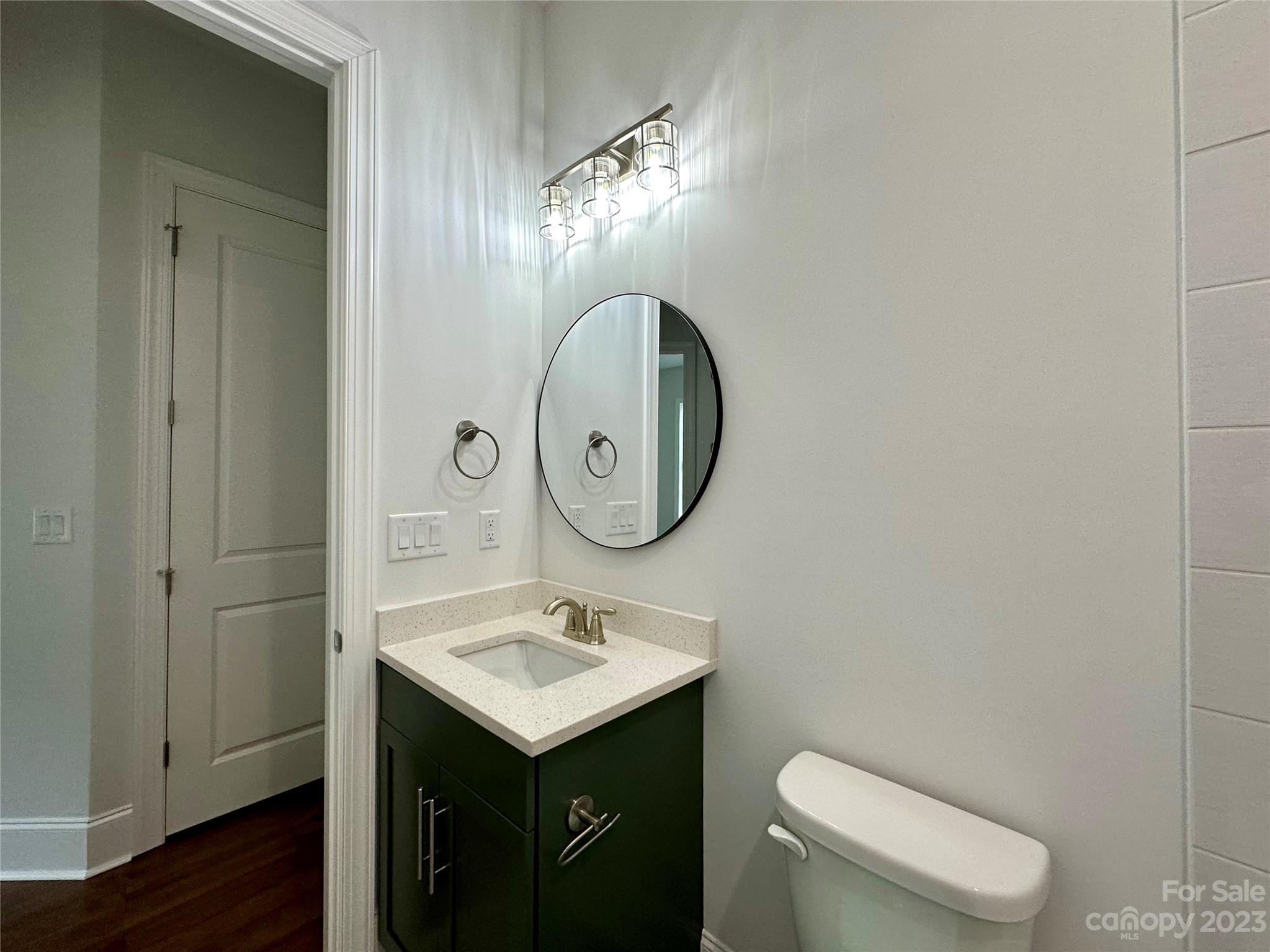 1427 Oak Park Road Rock Hill, SC 29730 - Photo 22 of 29 a bathroom with a toilet sink and mirror