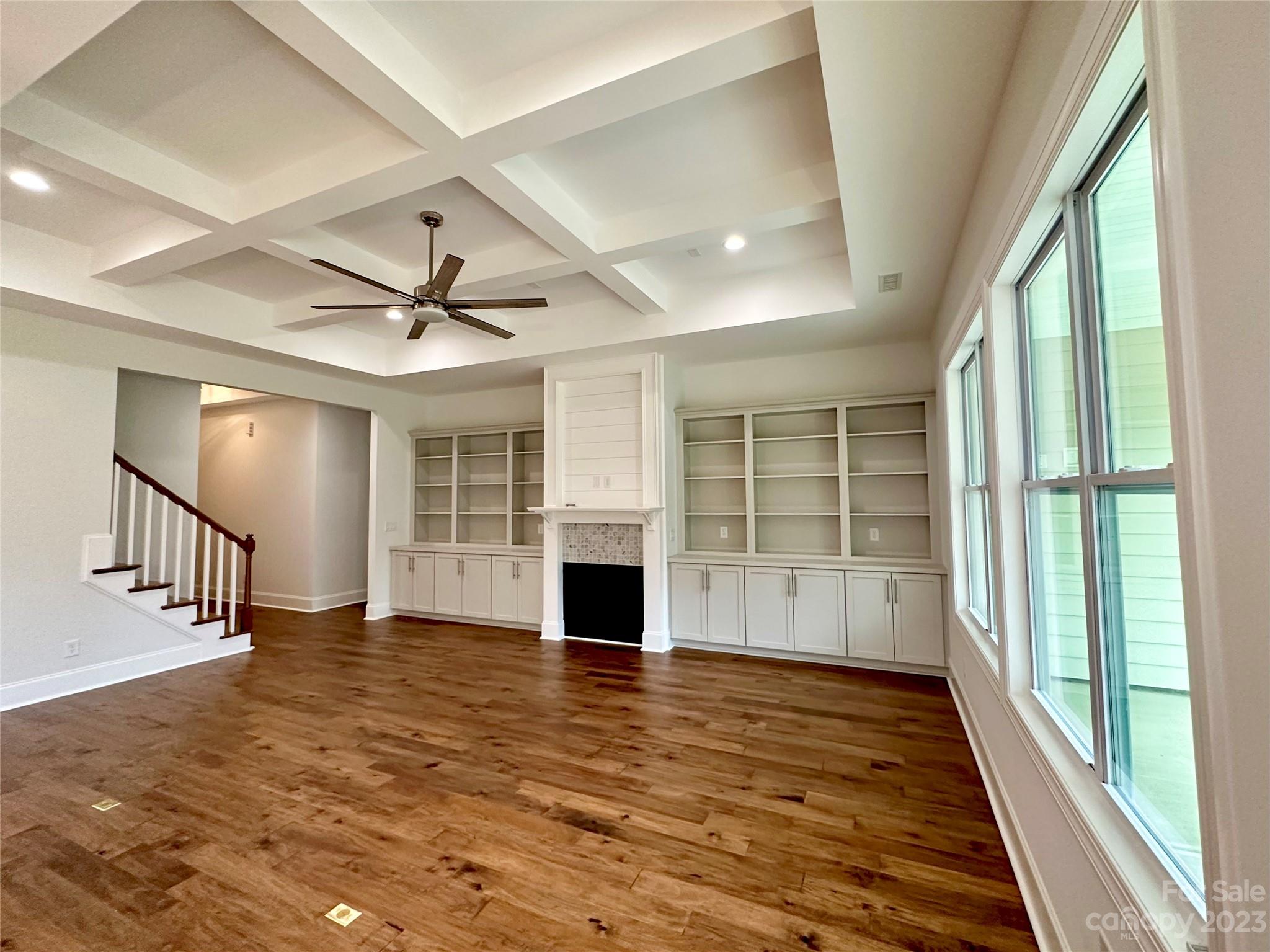 1427 Oak Park Road Rock Hill, SC 29730 - Photo 6 of 29 wooden floor in an empty room with a fireplace and a window