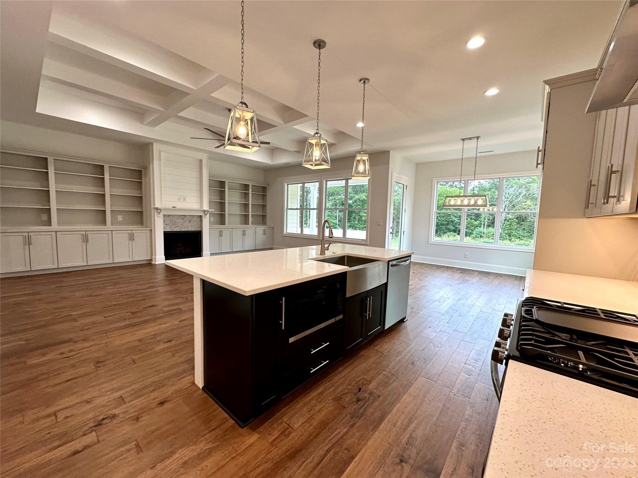 1427 Oak Park Road Rock Hill, SC 29730 - Photo 10 of 29 a kitchen with a stove a sink and wooden floor