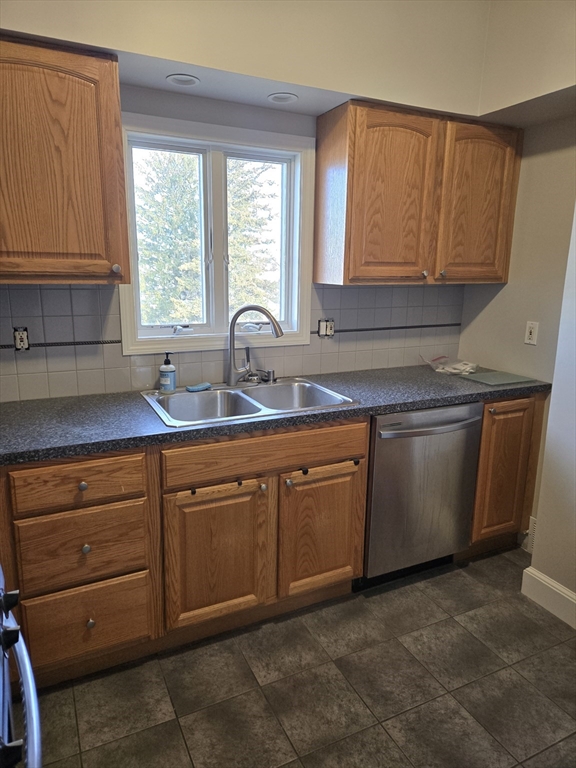 600 Charles Street, Unit 3 Fall River, MA 02724 - Photo 4 of 6 a kitchen with stainless steel appliances granite countertop a sink window and cabinets