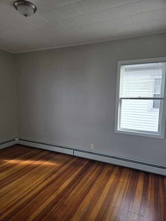 600 Charles Street, Unit 3 Fall River, MA 02724 - Photo 4 of 8 a view of a room with wooden floor and small window