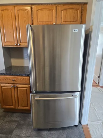 a stove top oven sitting inside of a kitchen