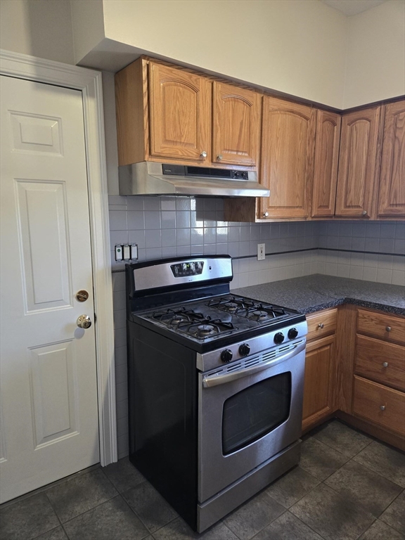 600 Charles Street, Unit 3 Fall River, MA 02724 - Photo 8 of 8 a stove top oven sitting inside of a kitchen