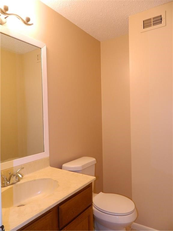 8500 Lyndon Lane, Unit B Austin, TX 78729 - Photo 12 of 22 a bathroom with a sink a toilet