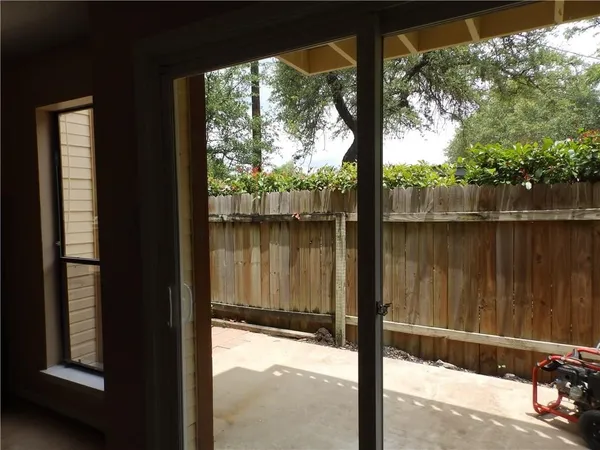 a view of balcony with furniture