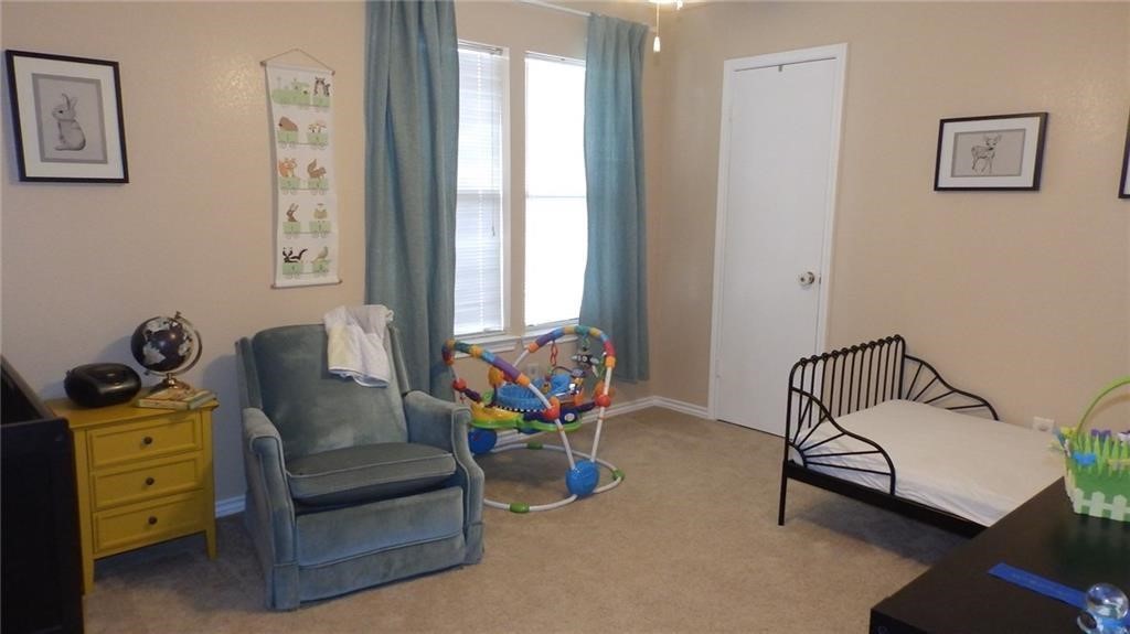 8500 Lyndon Lane, Unit B Austin, TX 78729 - Photo 18 of 22 a bedroom with furniture and window