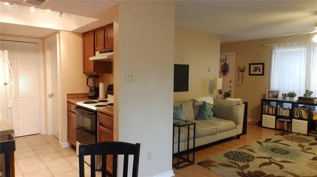 a living room with furniture and a rug