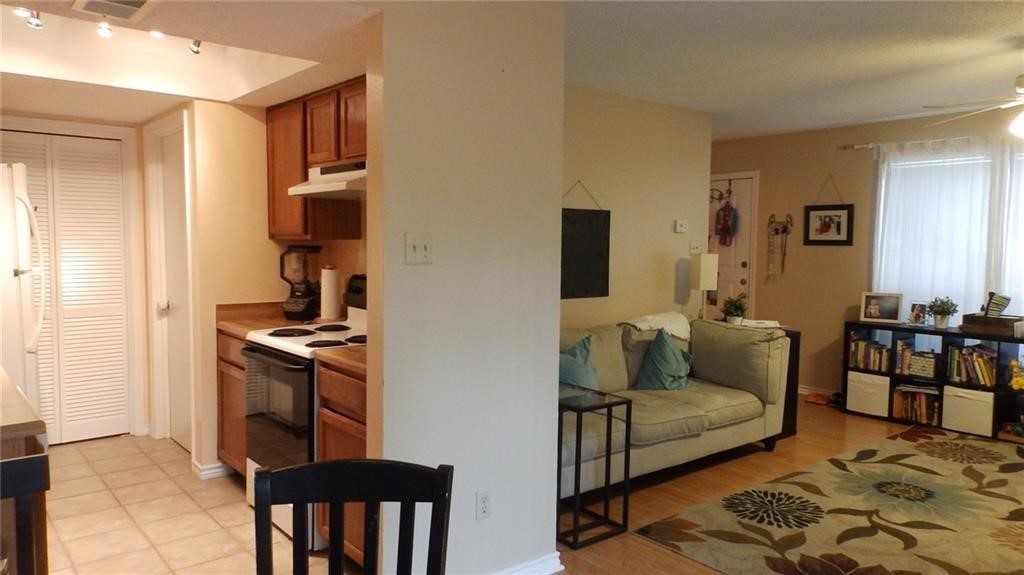 8500 Lyndon Lane, Unit B Austin, TX 78729 - Photo 4 of 22 a living room with furniture and a rug