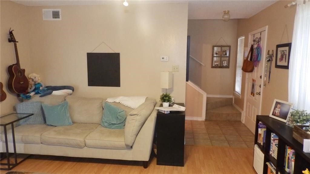 8500 Lyndon Lane, Unit B Austin, TX 78729 - Photo 5 of 22 a living room with furniture and a flat screen tv