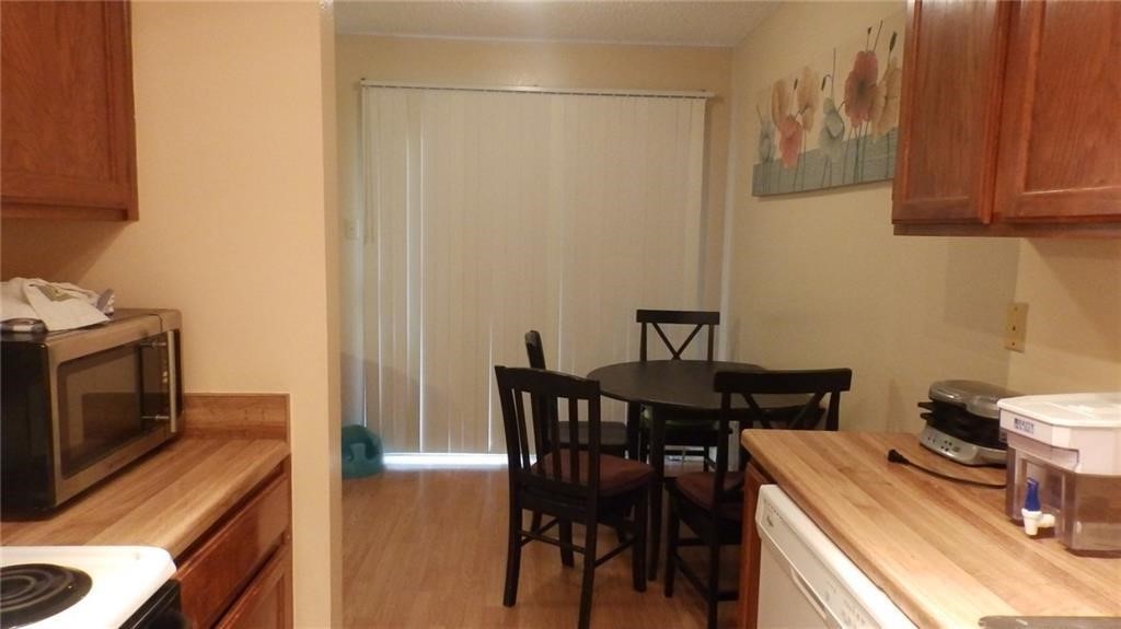 8500 Lyndon Lane, Unit B Austin, TX 78729 - Photo 9 of 22 a view of a dining room with furniture