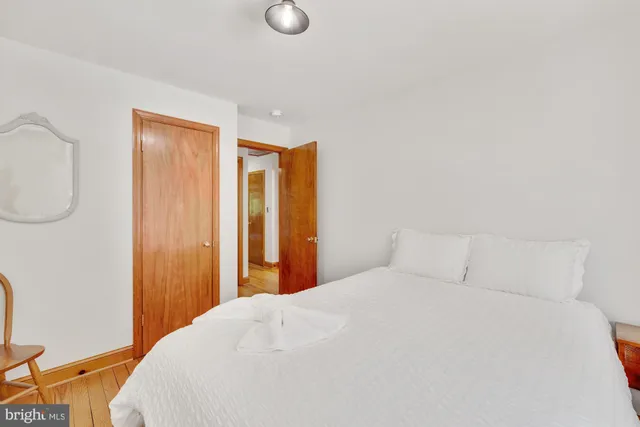 a bedroom with a bed and a closet