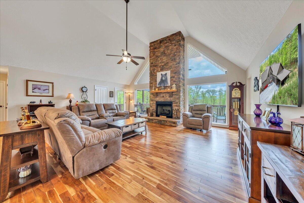 4029 Flatwoods Road Elliston, VA 24087 - Photo 5 of 39 a living room with furniture a fireplace and a floor to ceiling window