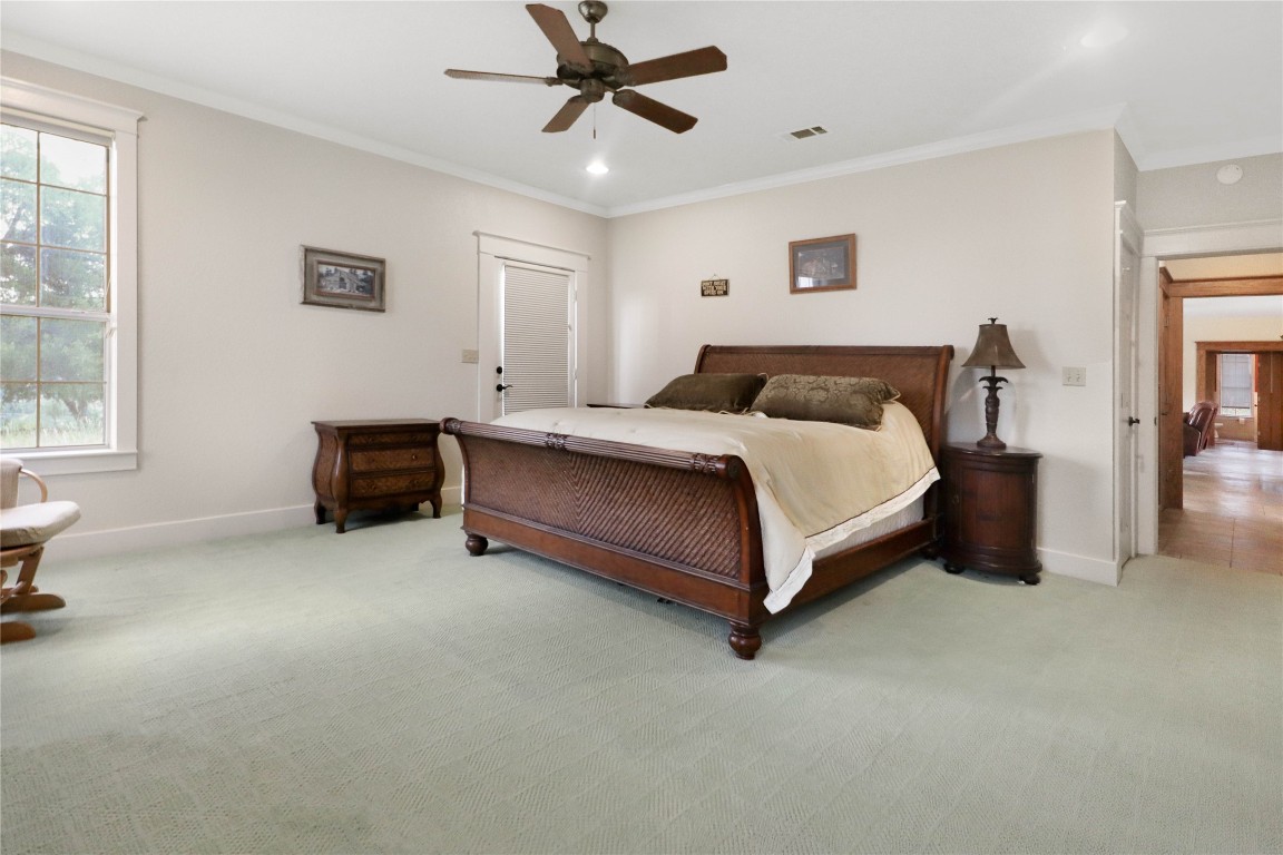 1428 Seven Spgs Drive Junction, TX 76849 - Photo 12 of 39 a spacious bedroom with a bed and a table