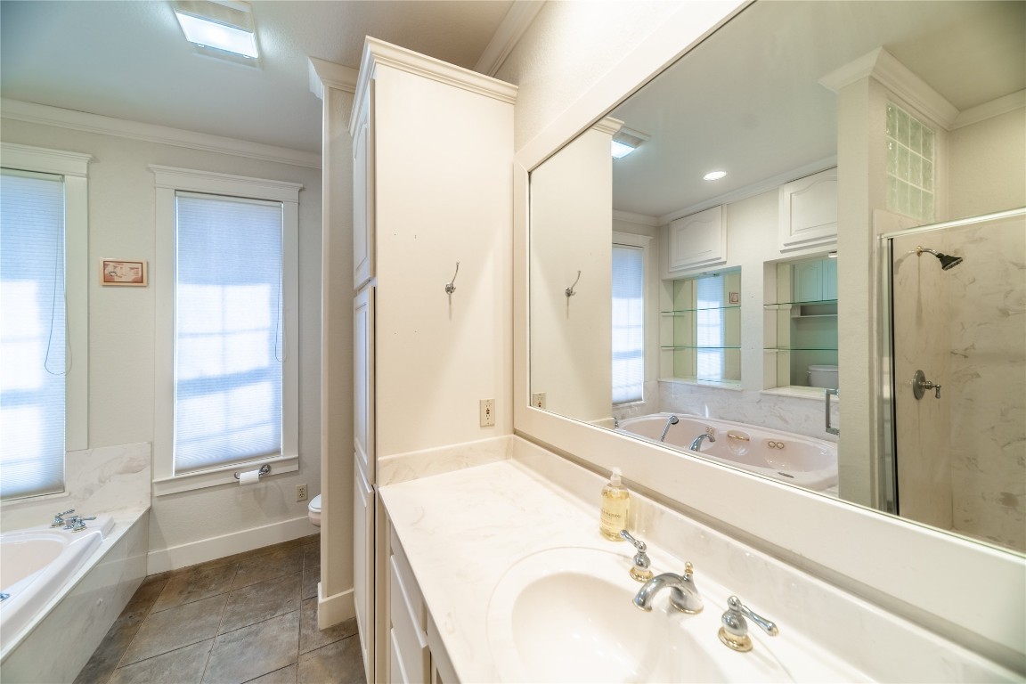 1428 Seven Spgs Drive Junction, TX 76849 - Photo 16 of 39 a bathroom with a tub sink shower and a mirror