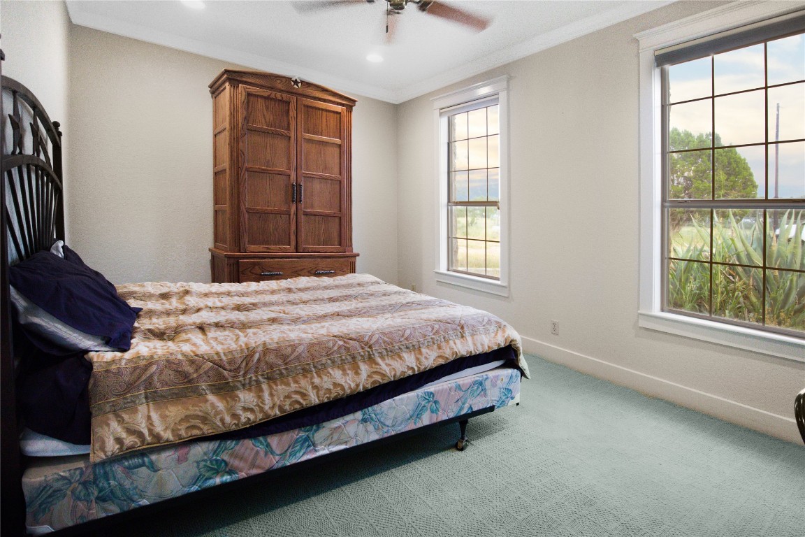 1428 Seven Spgs Drive Junction, TX 76849 - Photo 20 of 39 a bed sitting in a bedroom next to a window