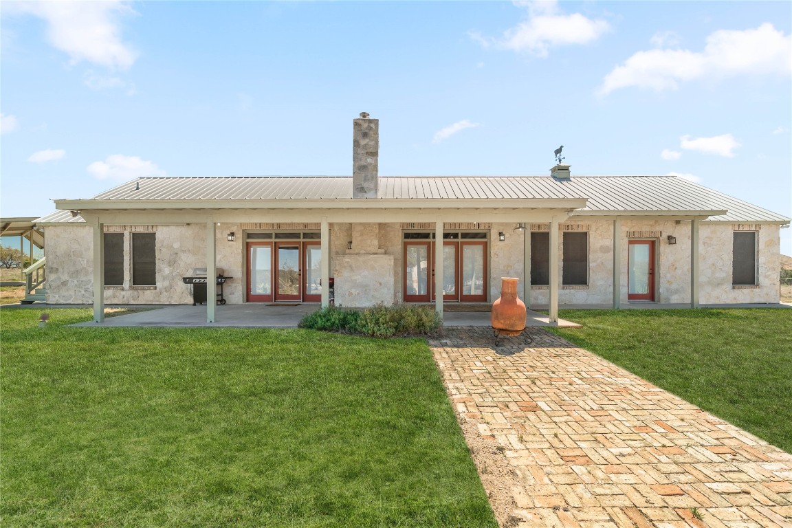 1428 Seven Spgs Drive Junction, TX 76849 - Photo 22 of 39 a view of a house with a backyard and porch