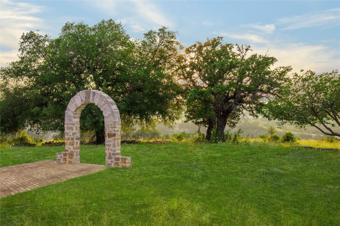 1428 Seven Spgs Drive Junction, TX 76849 - Photo 26 of 39 a backyard of a house with lots of green space and fountain
