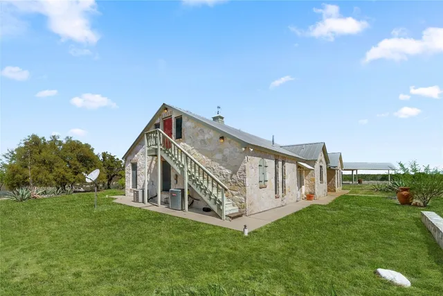 a view of a house with a big yard