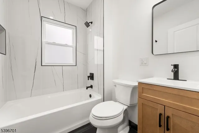 a bathroom with a sink a toilet and a bathtub
