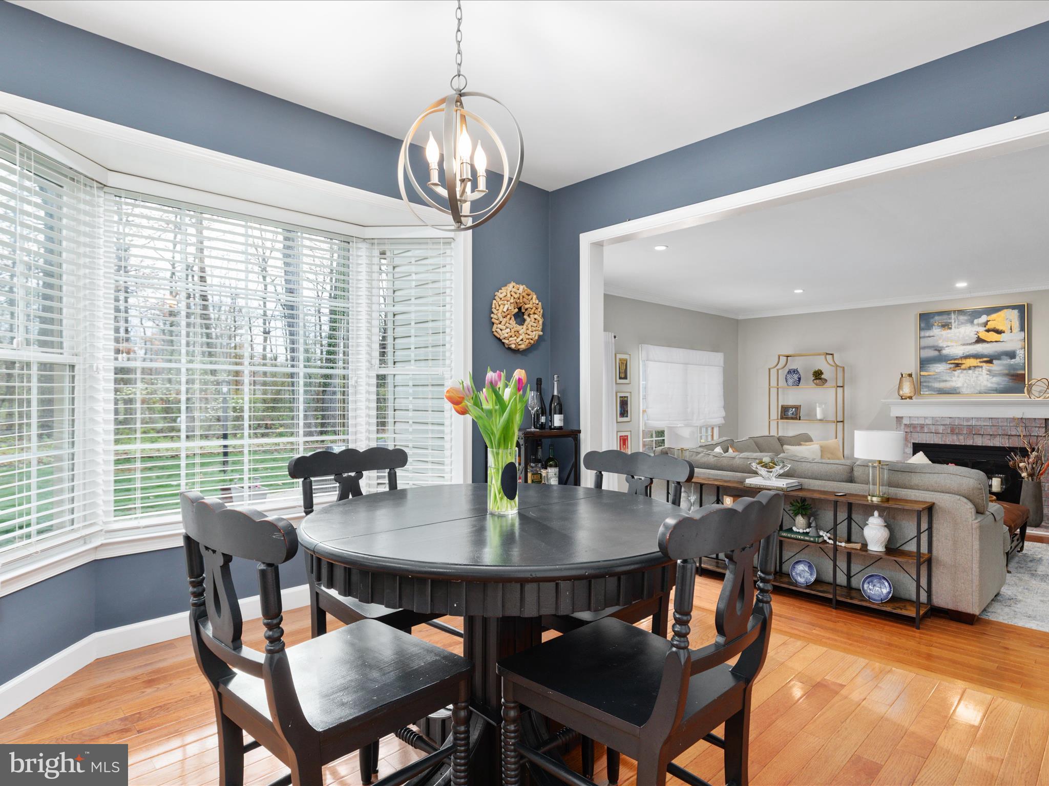 20299 Mustoe Place Ashburn, VA 20147 - Photo 14 of 45 a view of a dining room with furniture window and wooden floor