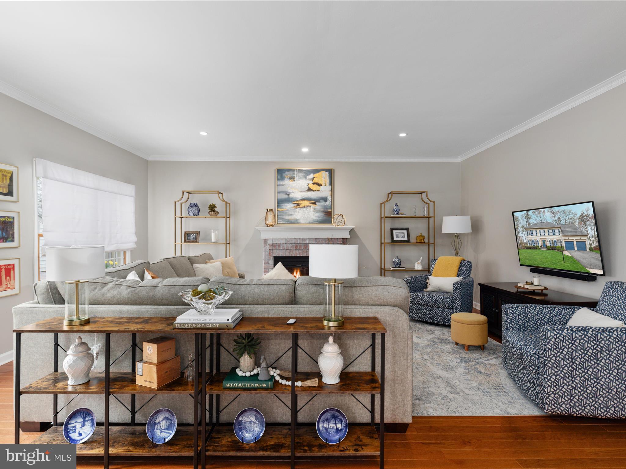 20299 Mustoe Place Ashburn, VA 20147 - Photo 15 of 45 a living room with furniture and wooden floor